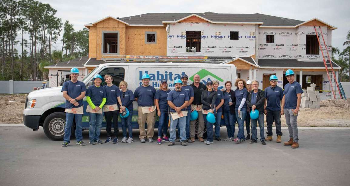 Diamond Custom Homes staff group united with Habitat for Humanity Collier